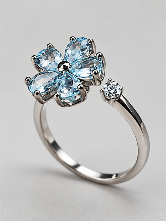 Anillo giratorio de circonita Flor Azul